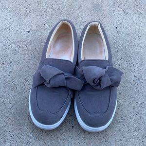 knotted grey and white dress shoes